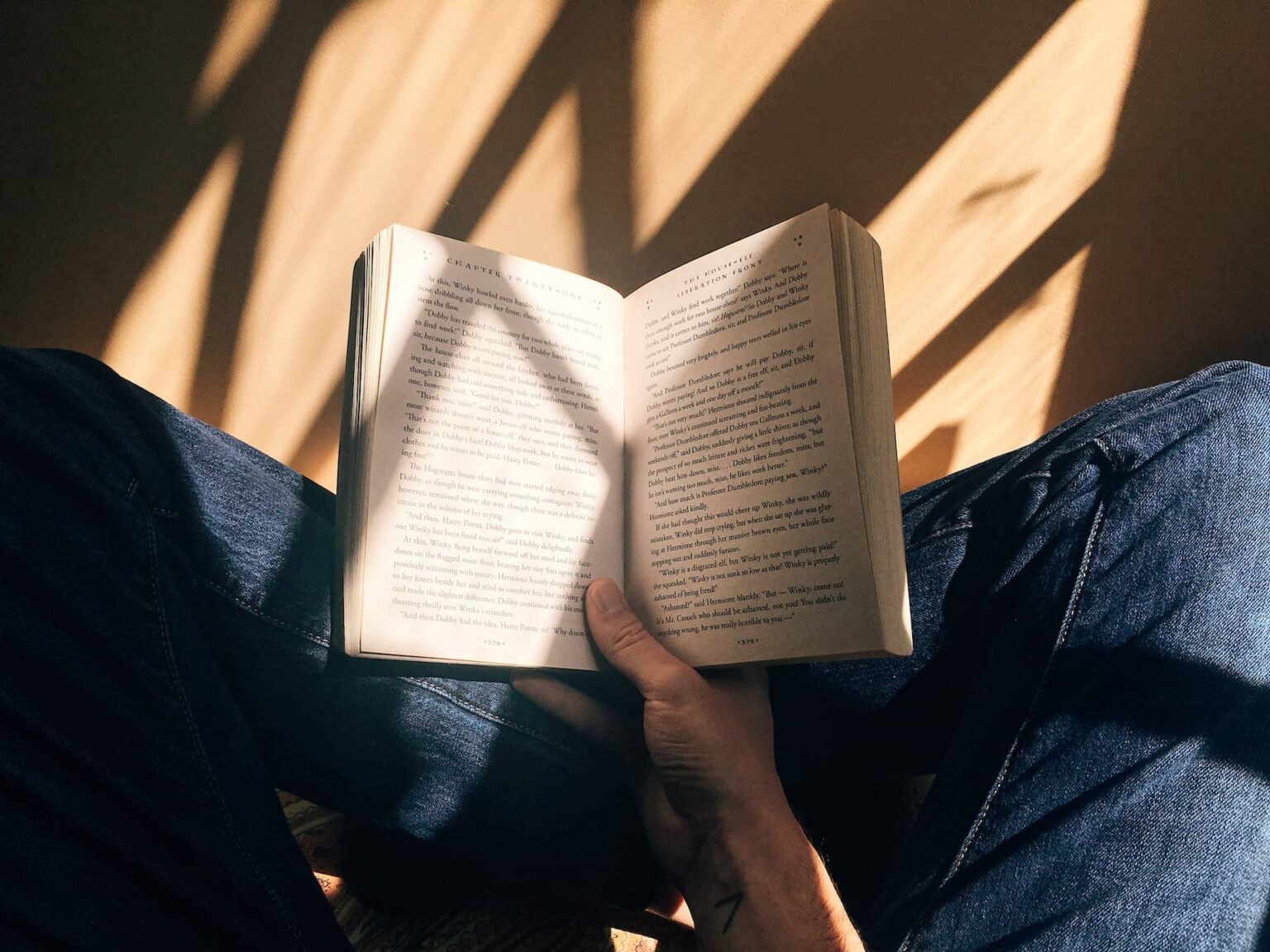 A person holding an open book.